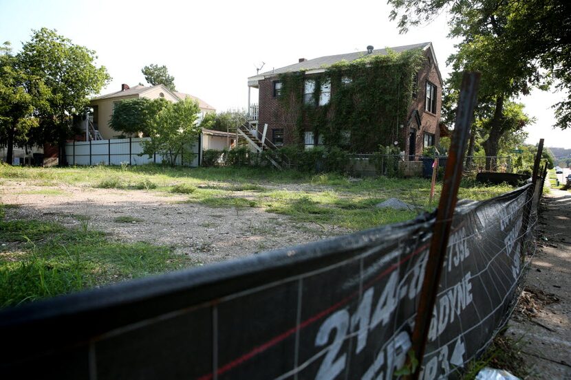 Tracy Popken Springer's home sits next to a cleared plot of land owned by Urban Genesis,...