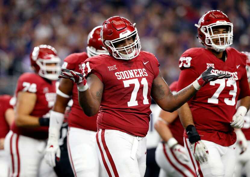 Oklahoma Sooners offensive lineman Bobby Evans (71) gestures to the sideline after the...