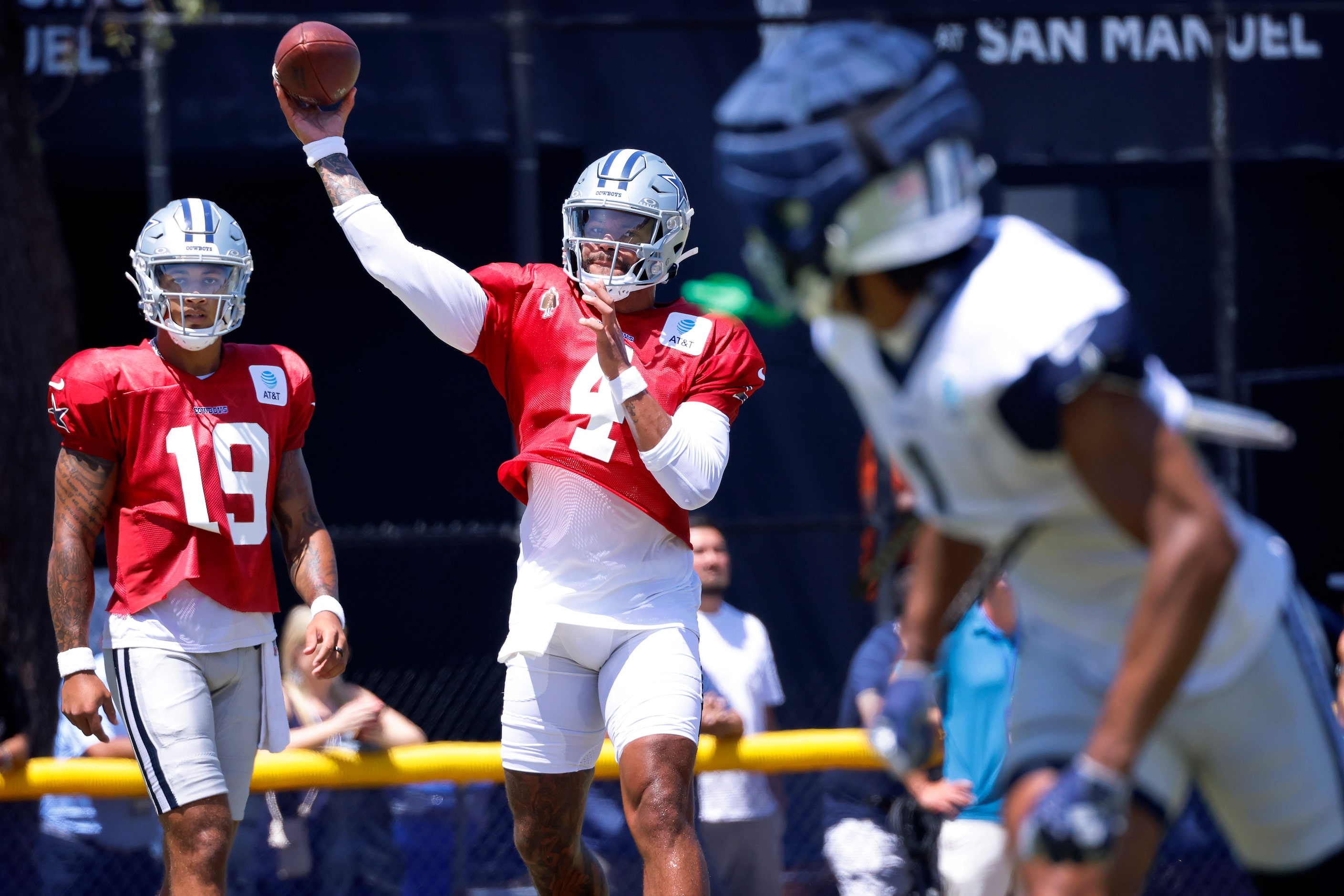 Dallas Cowboys quarterback Dak Prescott (4) throws a pass to wide receiver Jalen Tolbert (1)...