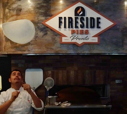 Fireside Pies chef Rafael Gonzalez prepared a pizza at Uptown Urban Market.