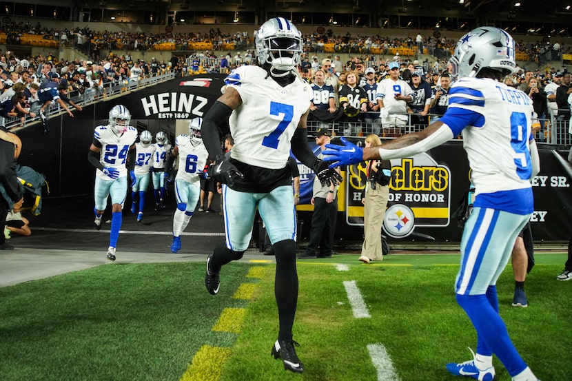 Dallas Cowboys cornerback Trevon Diggs (7) takes the field to warm up for an NFL football...