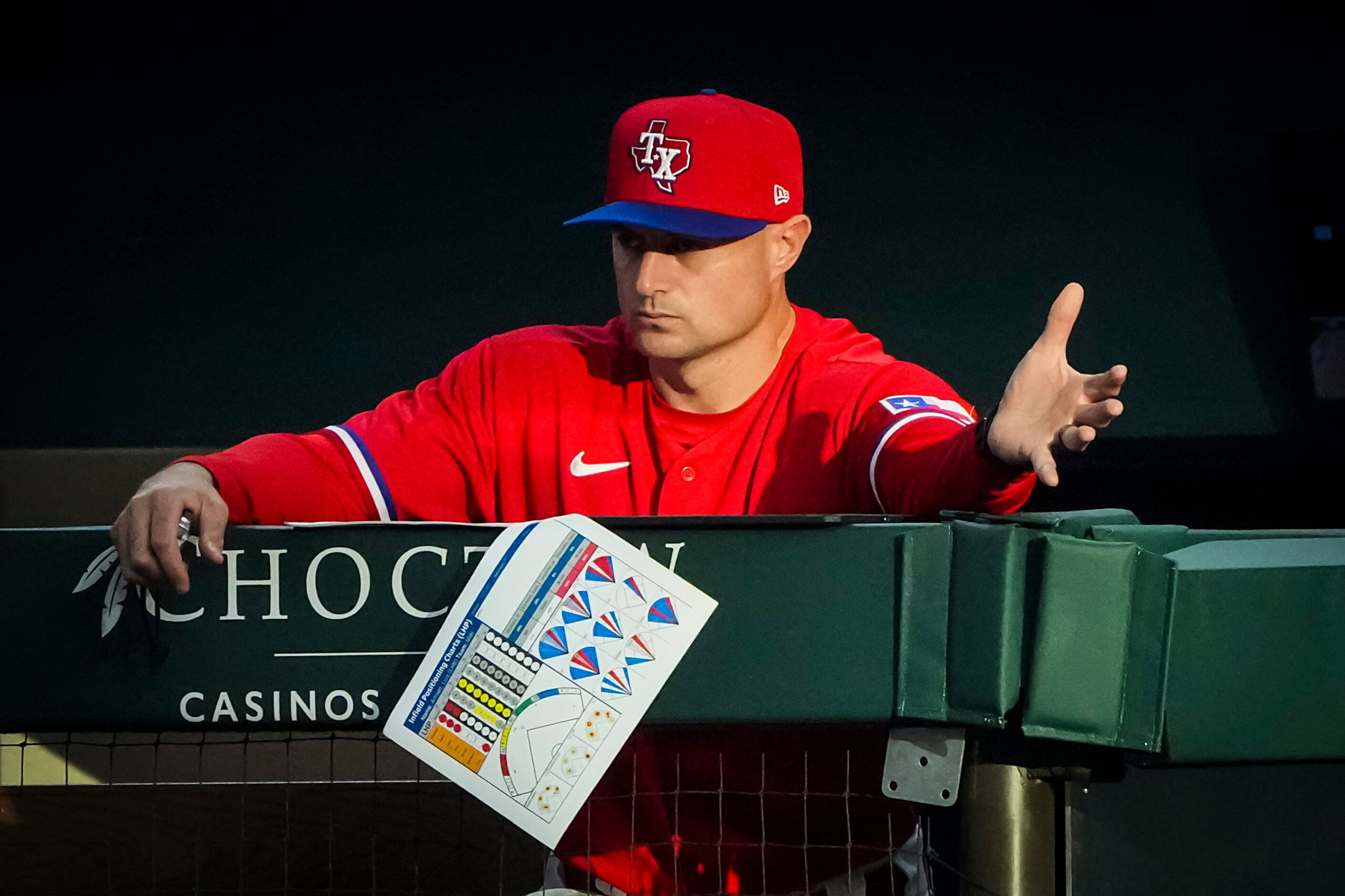 Texas Rangers first base coach Corey Ragsdale directs the team’s defense during the second...