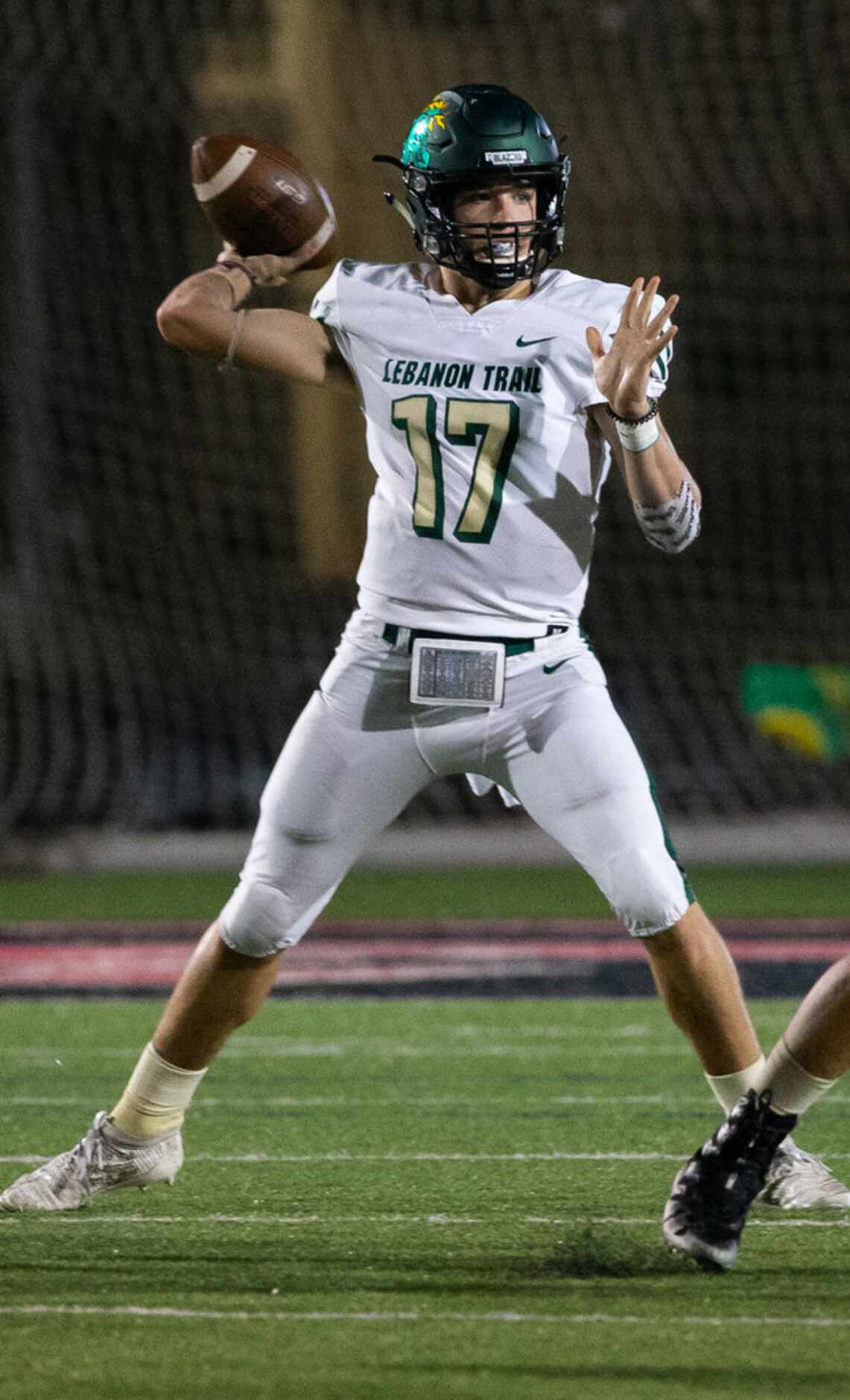 Lebanon Trail quarterback Drew Martin (17) looks to make a pass during the football game...