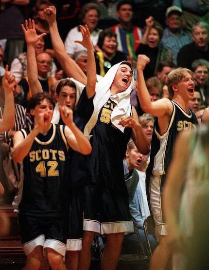 
Highland Park’s boys basketball team, including Jay Paul (42) and Chris Young (51),...