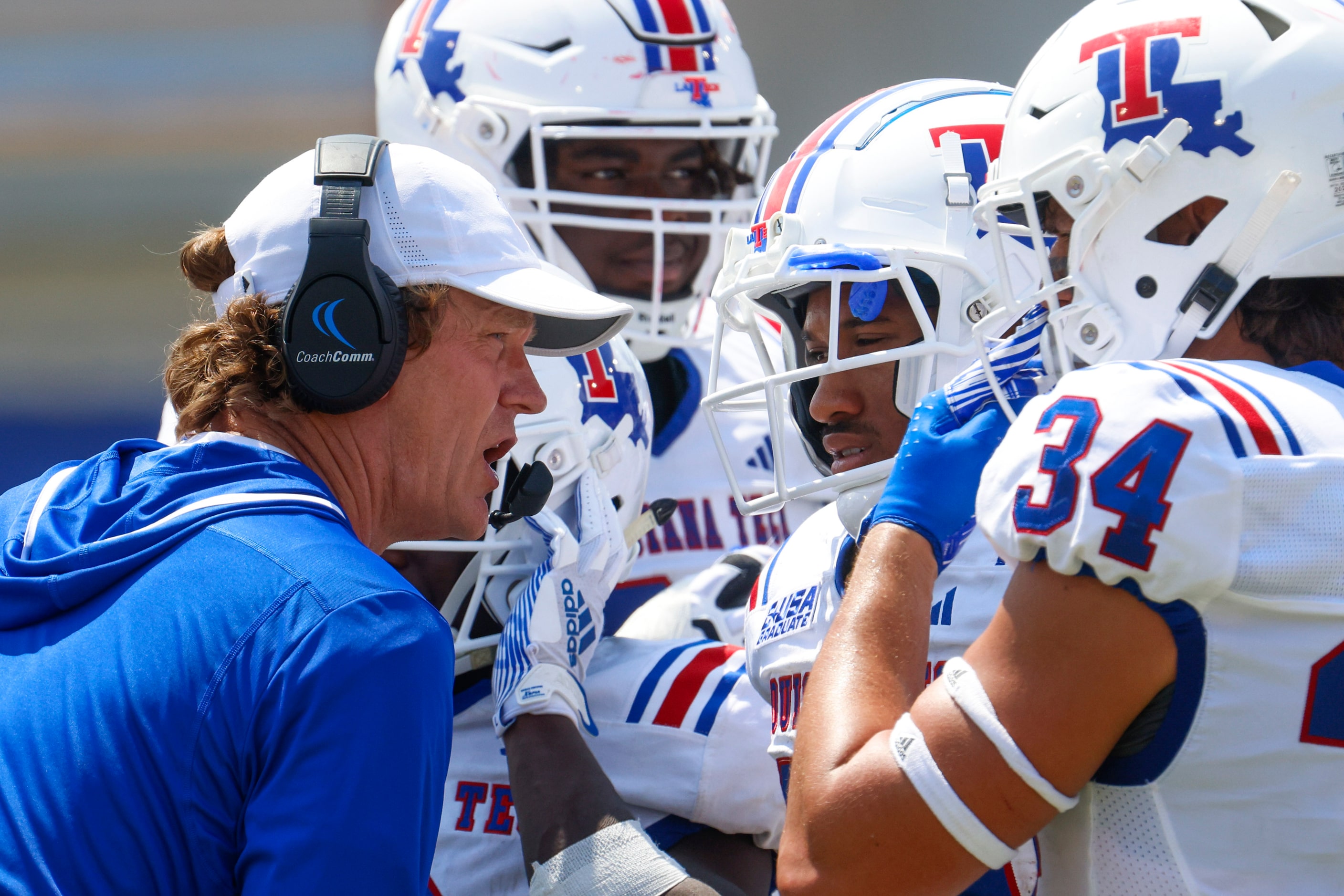 Louisiana Tech head coach Sonny Cumbie talks to the team during the second half of an NCAA...