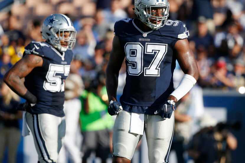Dallas Cowboys defensive end Taco Charlton (97) makes his way to the line after breaking...