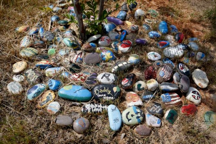 
Every year, campers paint a rock in memory of the loved one who died and place it under a...