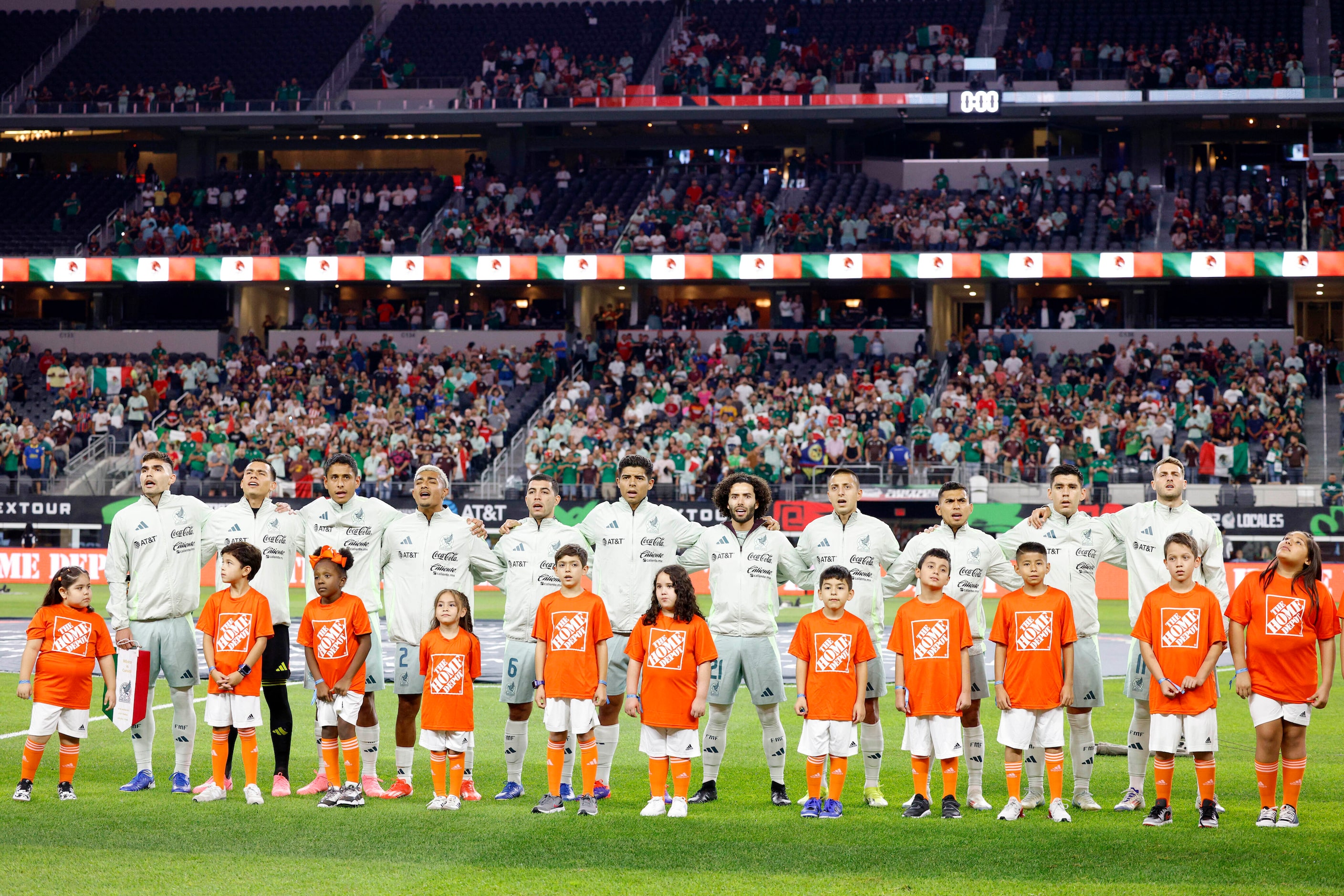 The Mexican national team sings the national anthem before the first half of an...