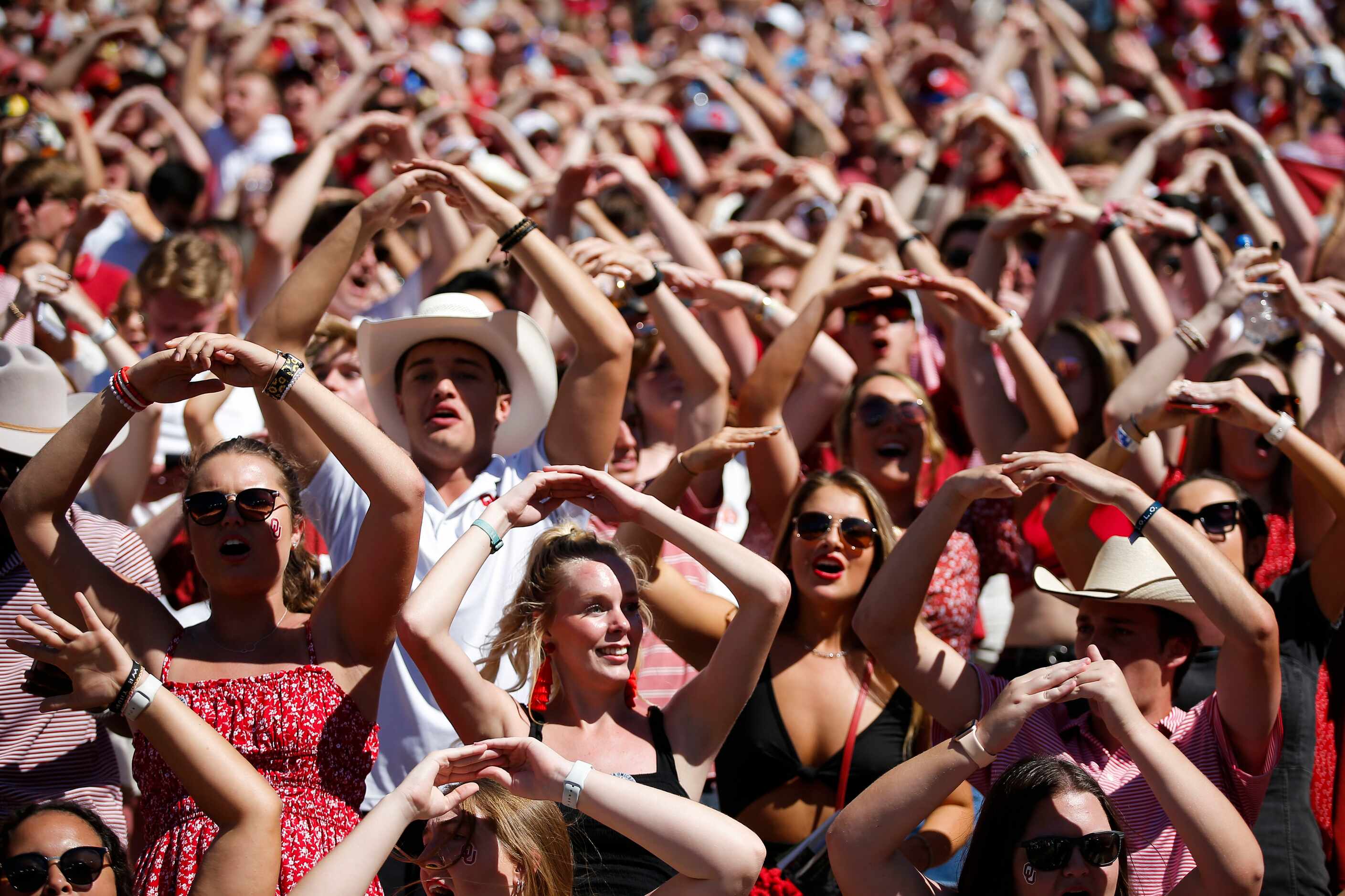 Oklahoma fans cheer on their team during the second half of an NCAA college football game...