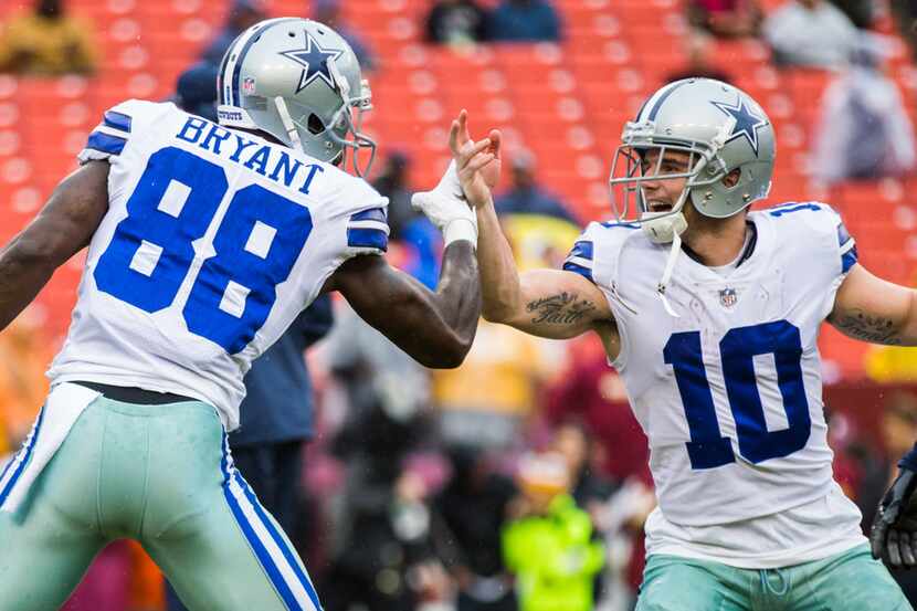 Dallas Cowboys wide receiver Dez Bryant (88) and wide receiver Ryan Switzer (10) high-five...