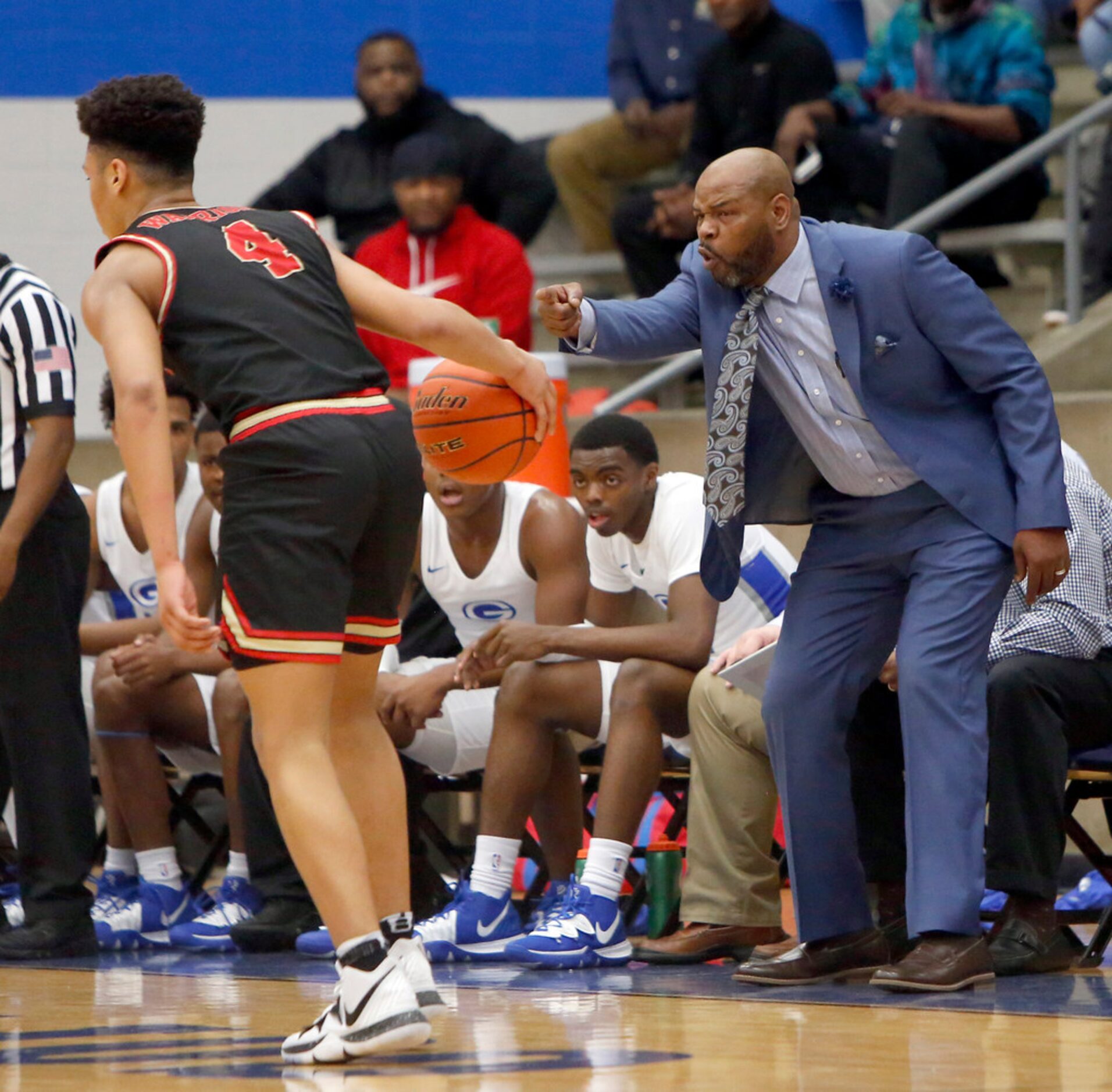 Grand Prtairie head coach Barron Brown directs the defensive position of his players as...