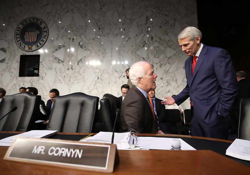 Texas Sen. John Cornyn (left) on Monday withdrew his support for Alabama Republican Roy...