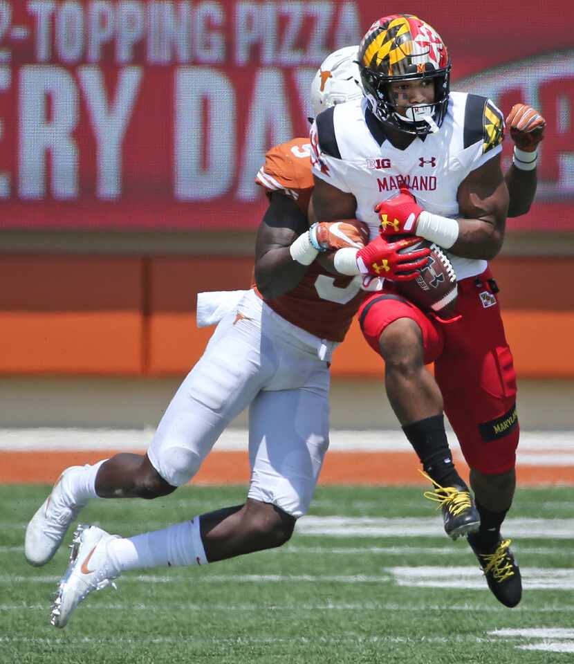 Maryland Terrapins wide receiver D.J. Moore (1) catches a long pass catch over Texas...