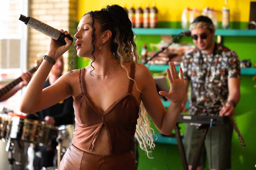 Sylvia Paola Ortiz, 28, lead singer for cumbia group Sabor Puro, performs inside La Pesca...