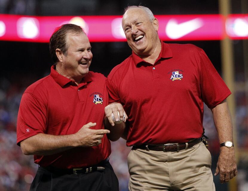 Texas Rangers president Nolan Ryan, right, and his former catcher Jim Sundberg walk to the...