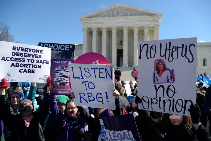 Supporters of legal access to abortion, as well as anti-abortion activists, rally outside...