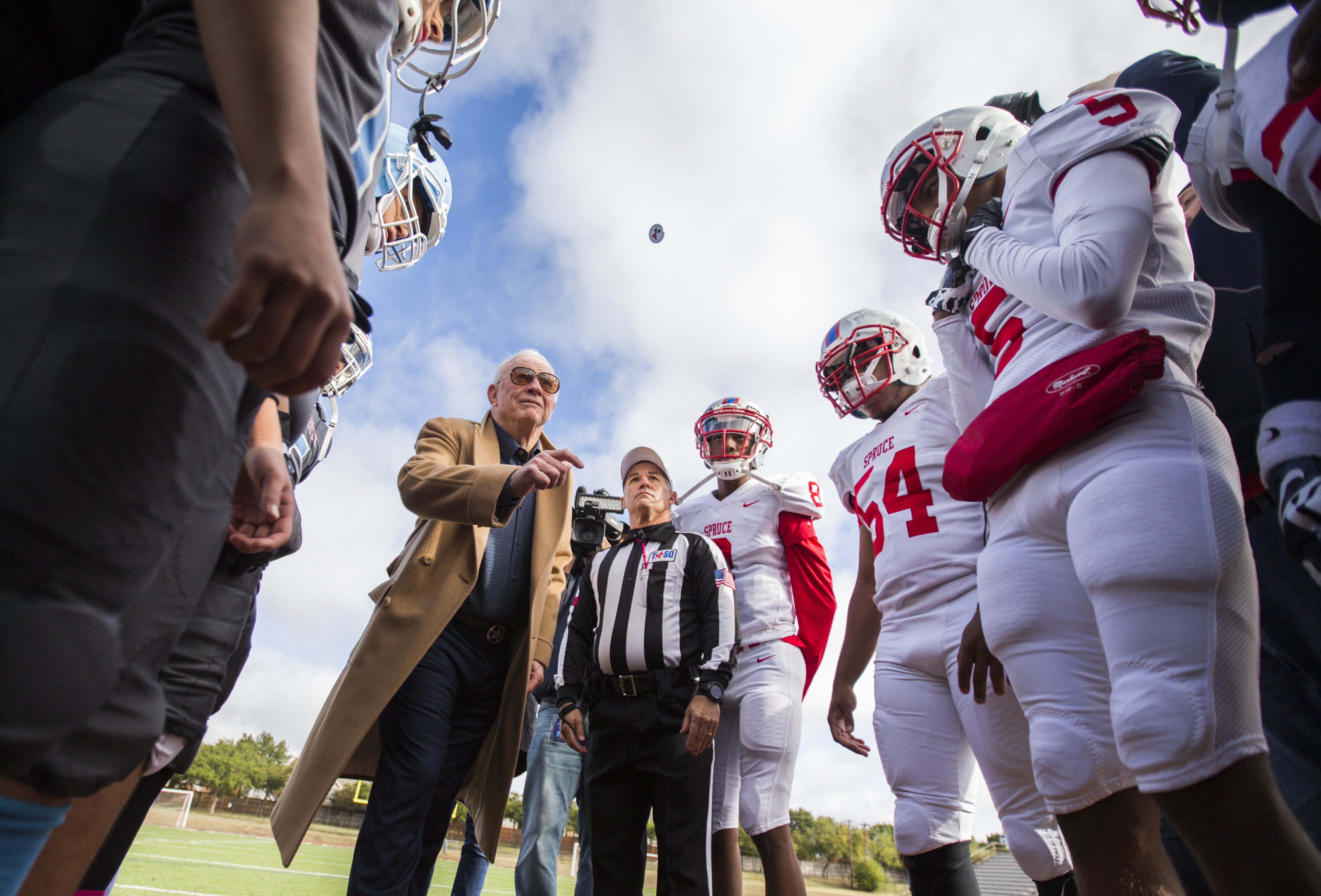 Dallas Cowboys Owner Jerry Jones performed the coin toss before Thomas Jefferson High School...