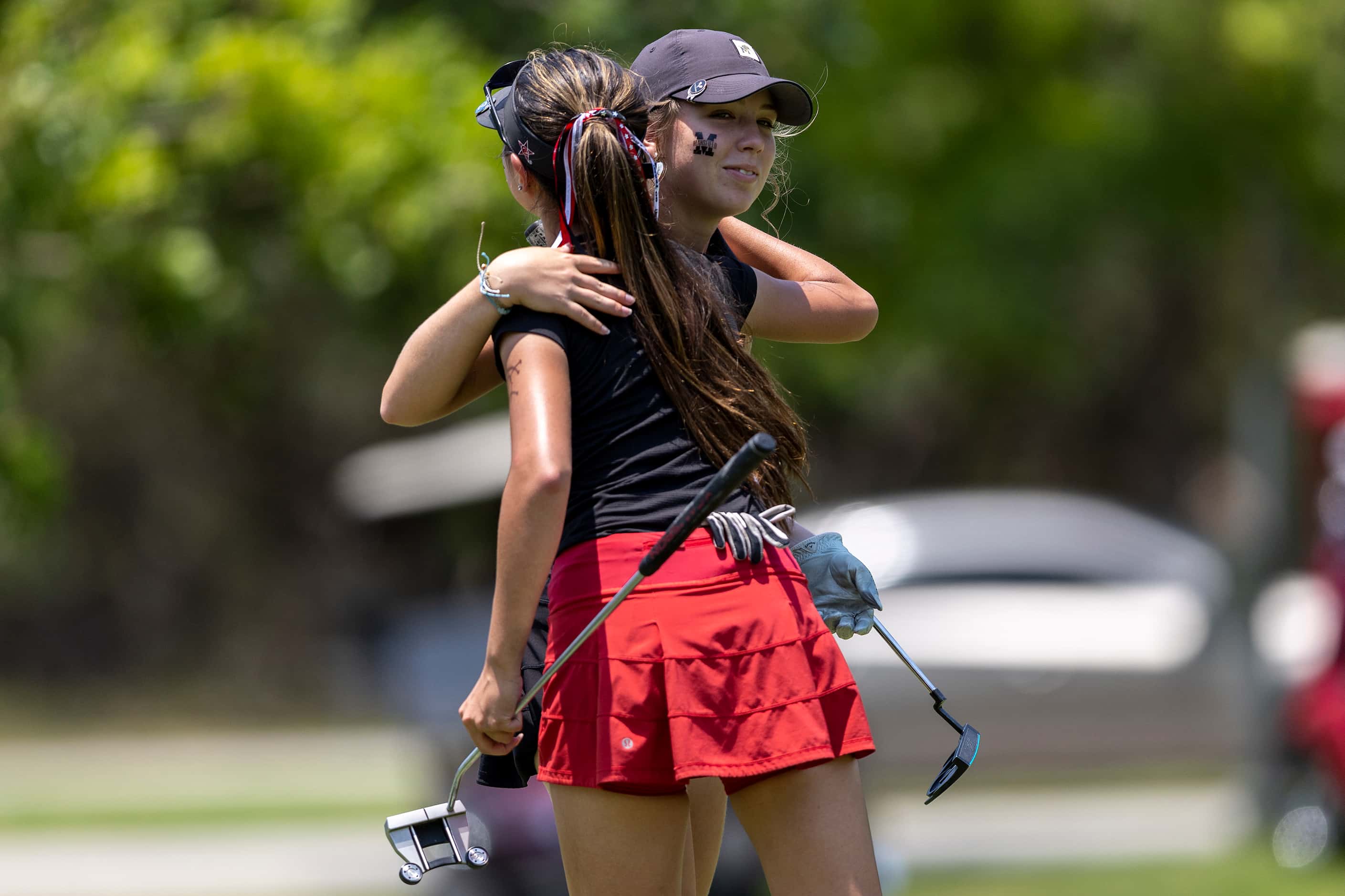 Coppell’s Mia Gaboriau, left, and Mansfield’s Abby Hirtzel embrace after finishing the first...