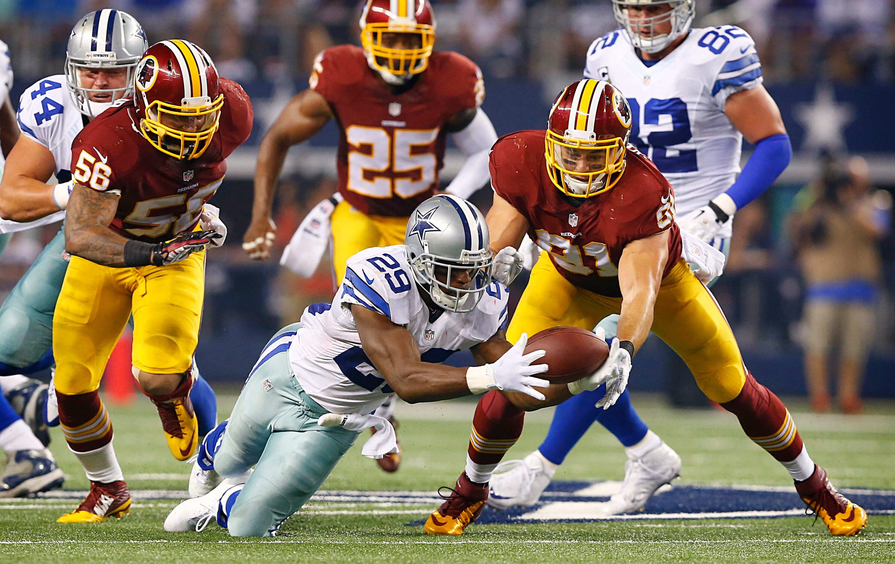 DeMarco Murray recovers his own fumble in the second half at AT&T Stadium, Monday, October...