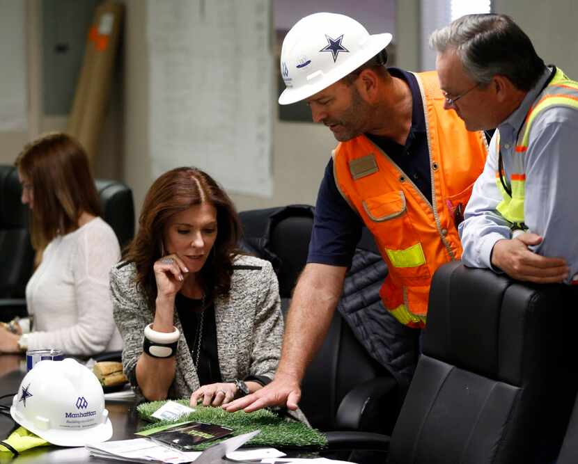 Stadium General Manager, Jeff Stroud (Center) of the Dallas Cowboys shows Charlotte Jones...