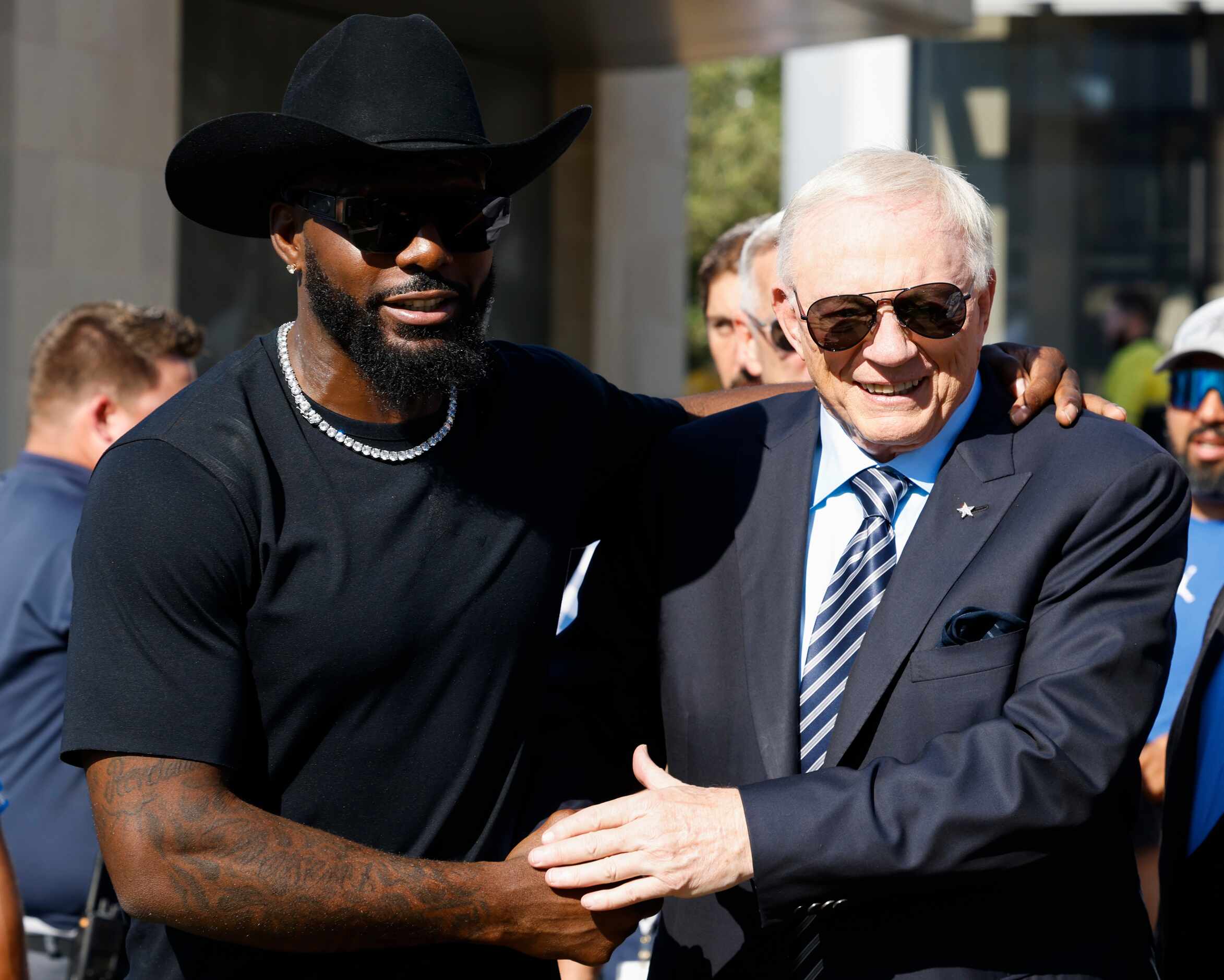 Former Dallas Cowboys player Dez Bryant, left, shakes hand with Dallas Cowboys owner Jerry...