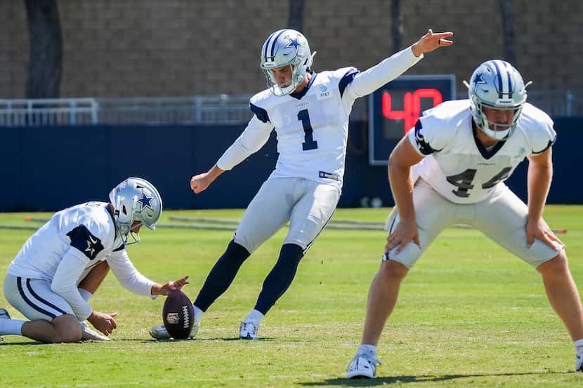 Dallas Cowboys kicker Brandon Aubrey attempts a field goal from the hold of punter Bryan...