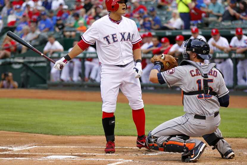 Texas Rangers left fielder Shin-Soo Choo (17) reacts to the umpires called strike in the...