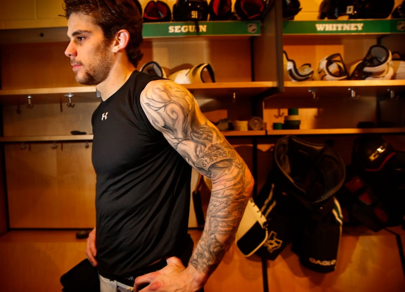 Dallas Stars Tyler Seguin displays a tattoo depicting his family and their attributes in...