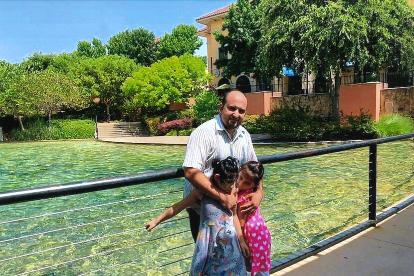 Mahir Ahmad Amiri with his two daughters, Nada and Zianib, at a park in Dalla months before...