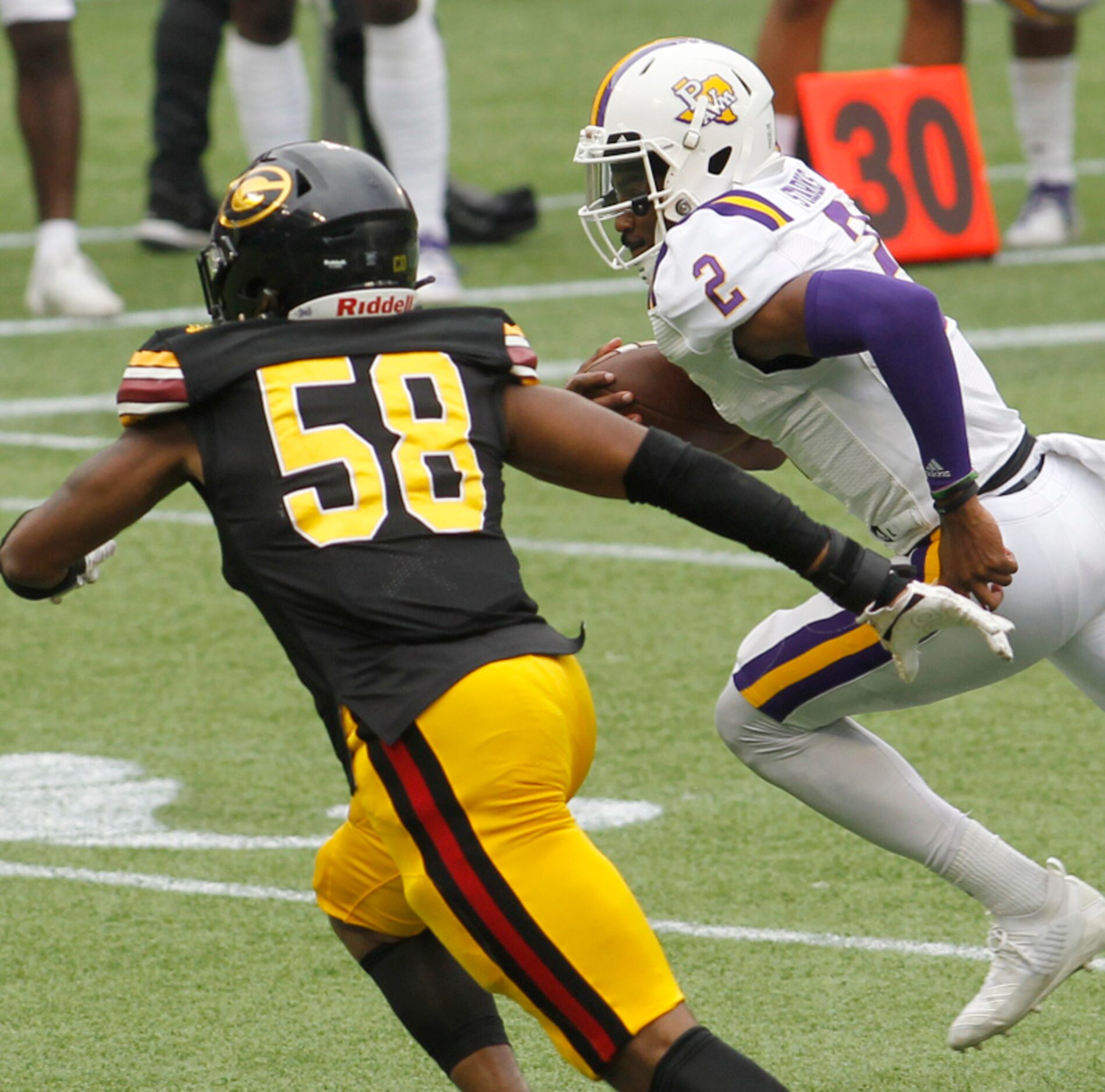 Prairie View A&M quarterback Tyriek Starks (2) sprints out of the backfield as Grambling...