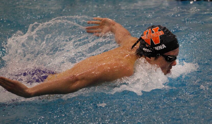 Frisco Wakeland's Conor McKenna powers to the finish line to win the Boys 100 yard Butterfly...