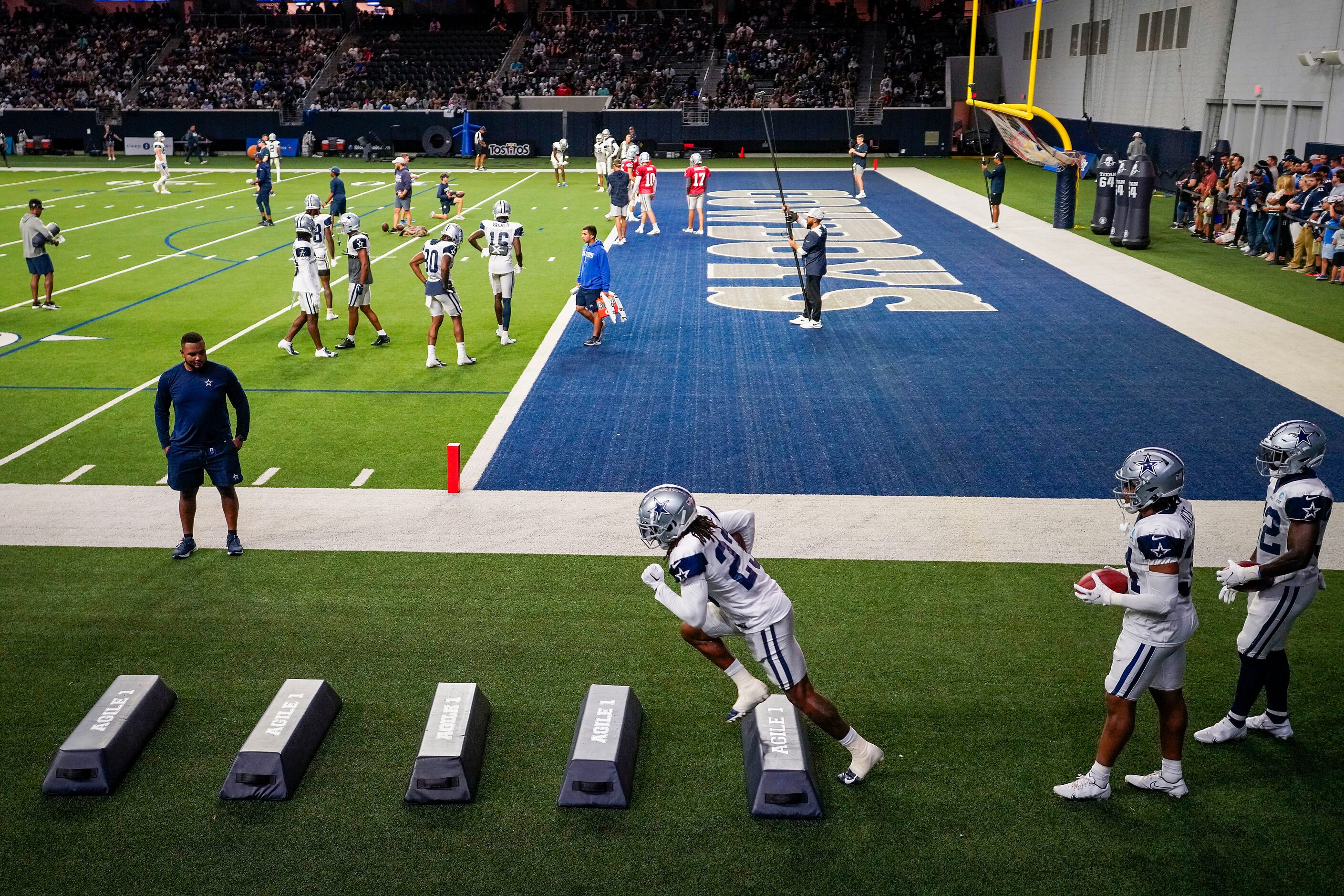 Dallas Cowboys running back Rico Dowdle (23) runs a drill during a training camp practice at...