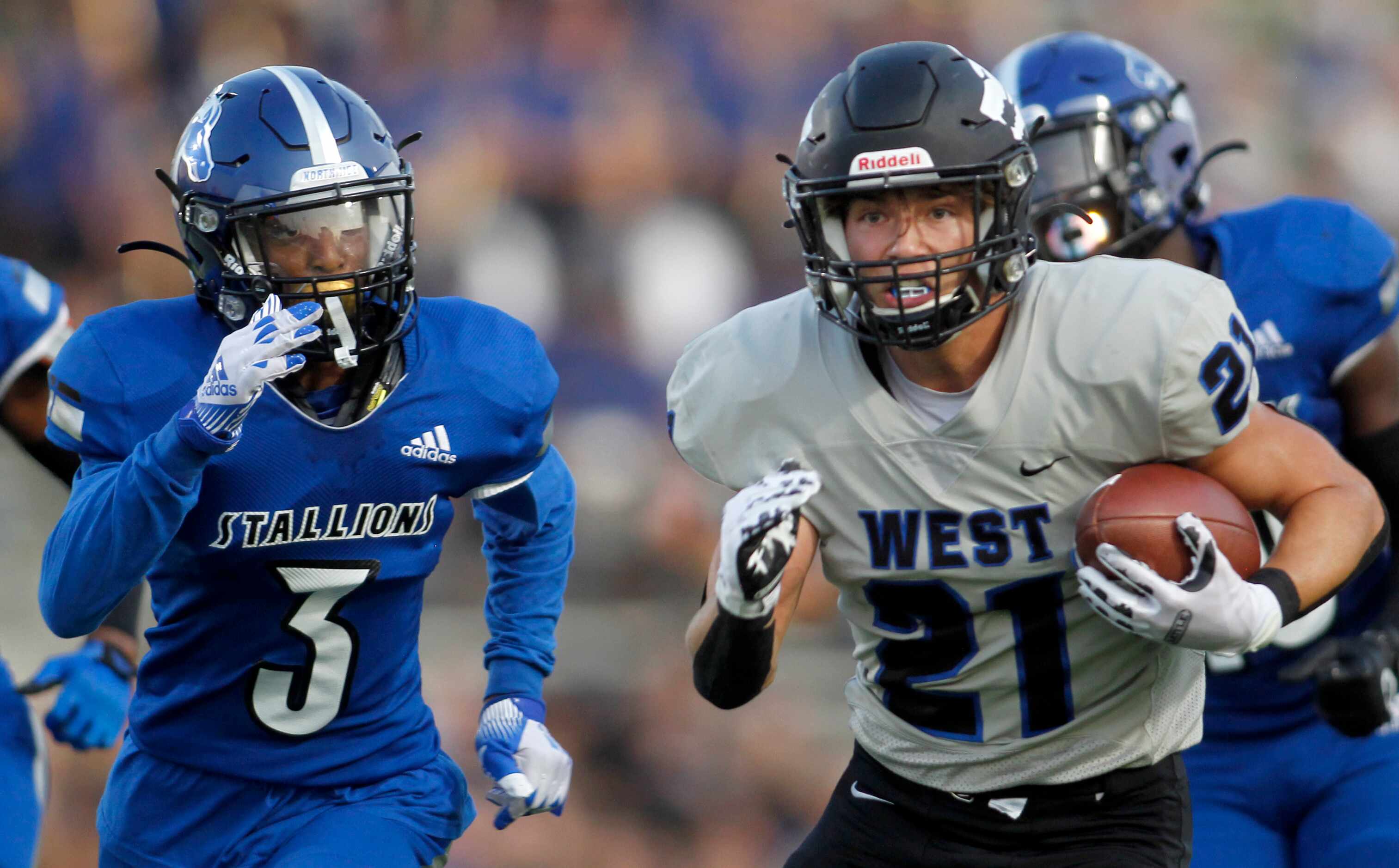 Plano West running back Dermot White (21) rambles into the North Mesquite secondary as...