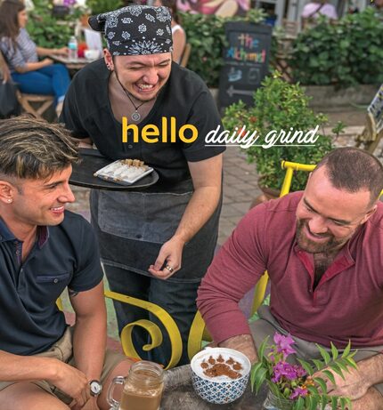 Brendon Lies (center) serves customers at a coffee house in a magazine ad for tourism in...