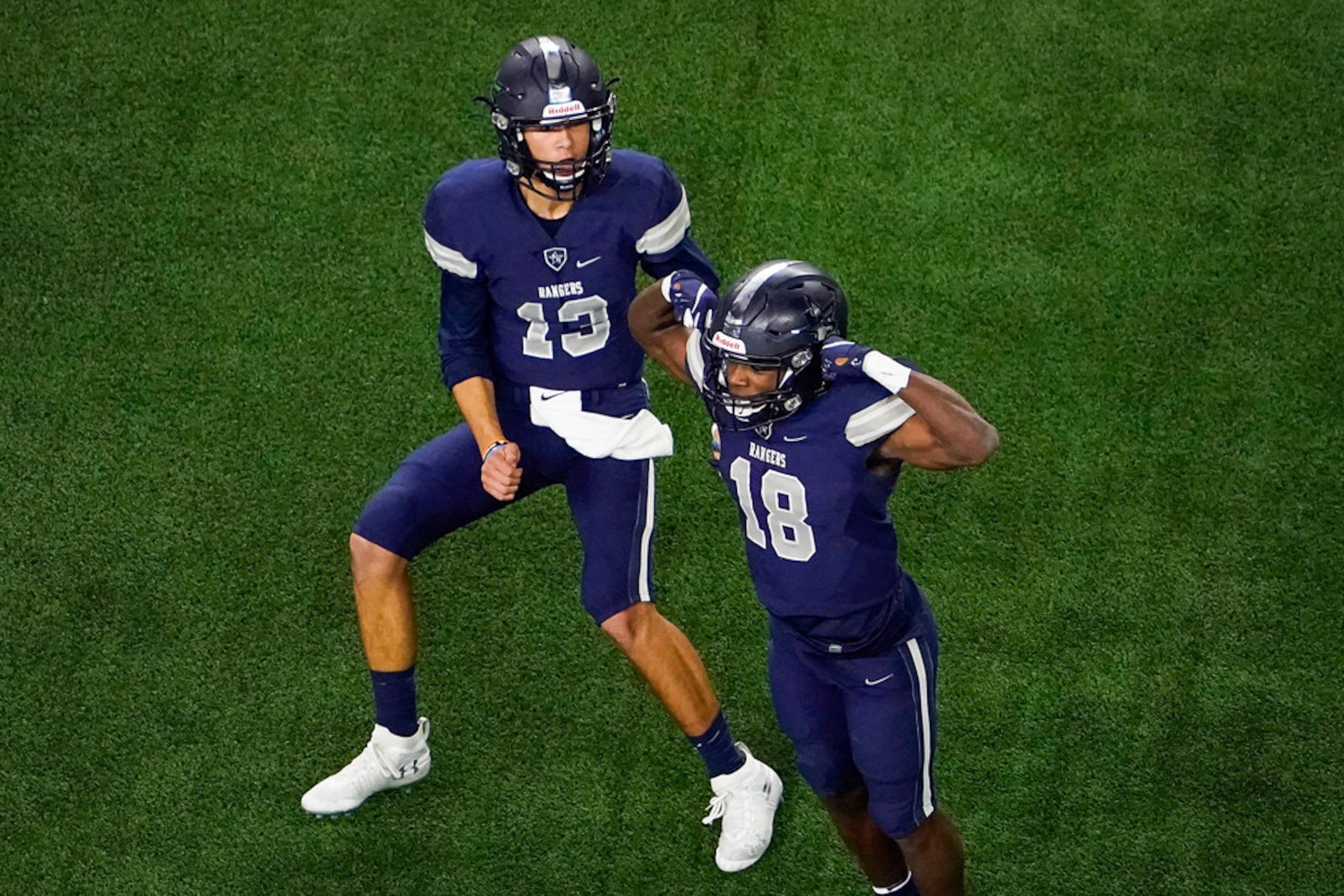 Frisco Lone Star wide receiver Marvin Mims (18) celebrates with quarterback Garret Rangel...