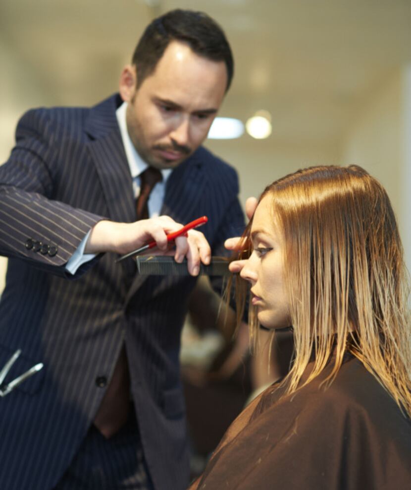 Henry cutting Tara Tonini's hair after she has had her ombre treatment.