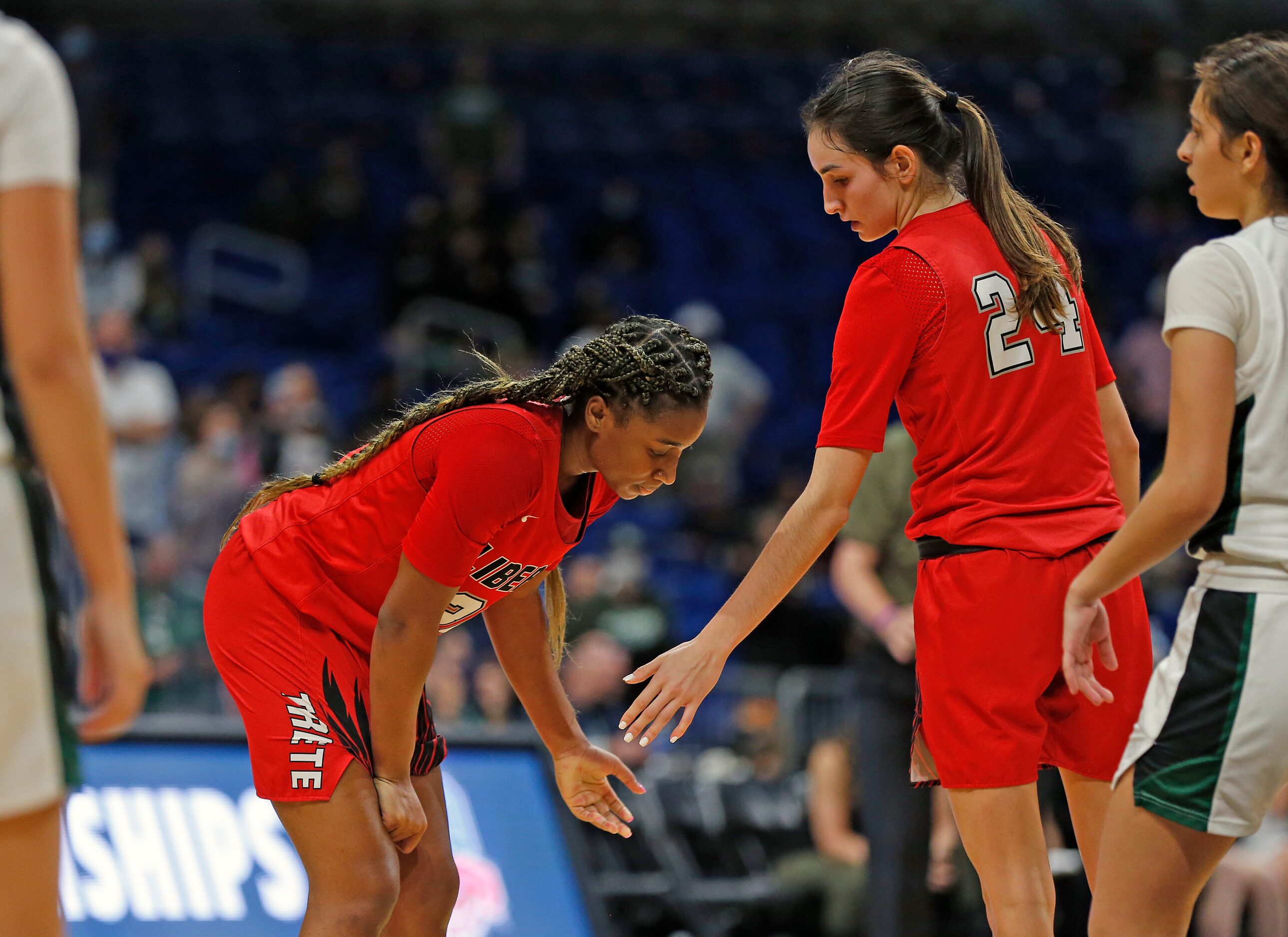 Frisco Liberty Jazzy Owens-Barnett #30 is consoled by Frisco Liberty Maya Jain #24 after she...