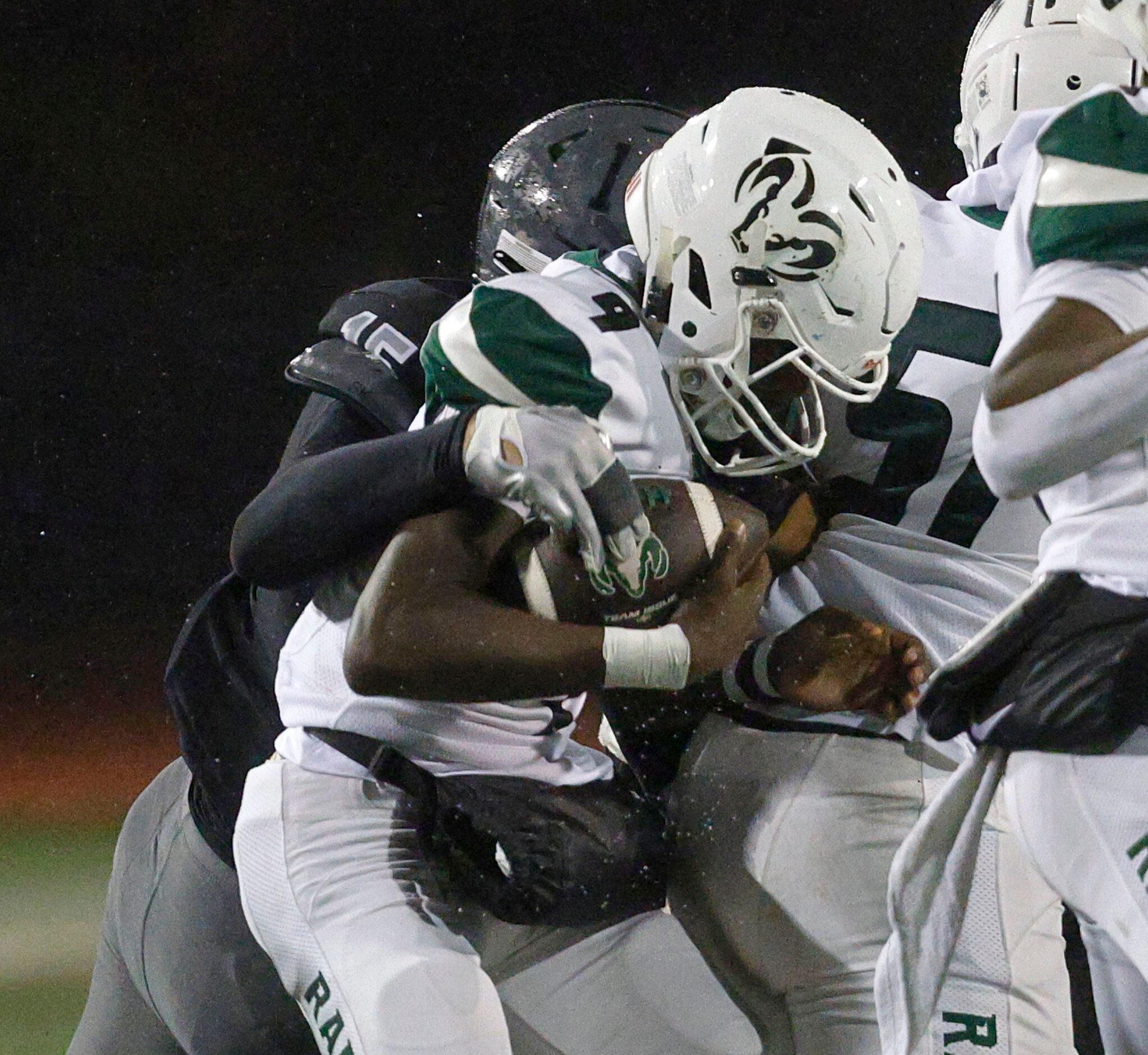 Berkner's quarterback Daquan Dunn (9) is sacked by Martin's Jesse Ford (15) during the first...