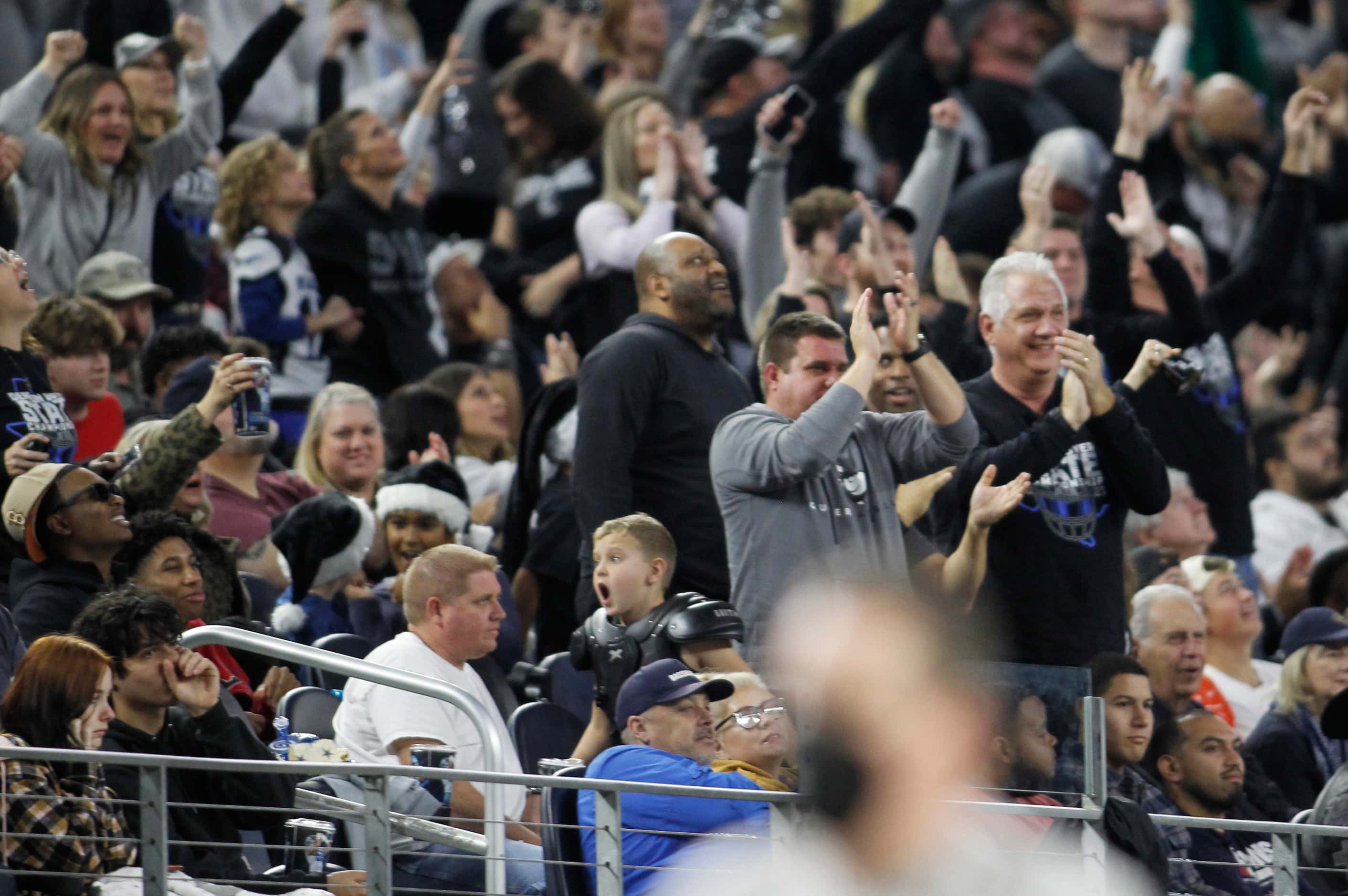 Denton Guyer fans react to a turnover during first quarter action against Austin Westlake....
