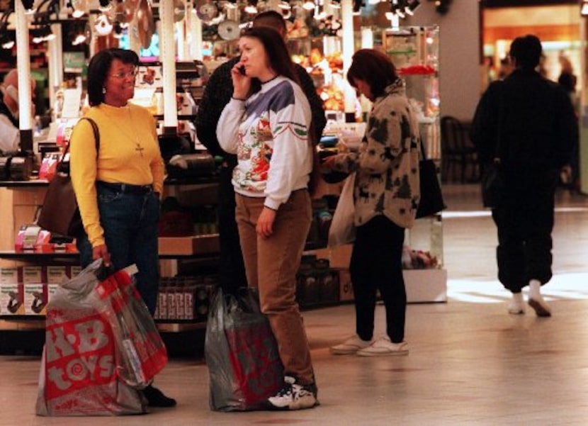 (Left to right) Carlene Knebel waited while friend Kathy Fox spoke to their babysitter on...