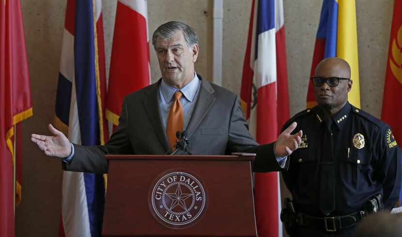 Mayor Mike Rawlings spoke about the DPD crime reduction strategy next to Dallas Police Chief...