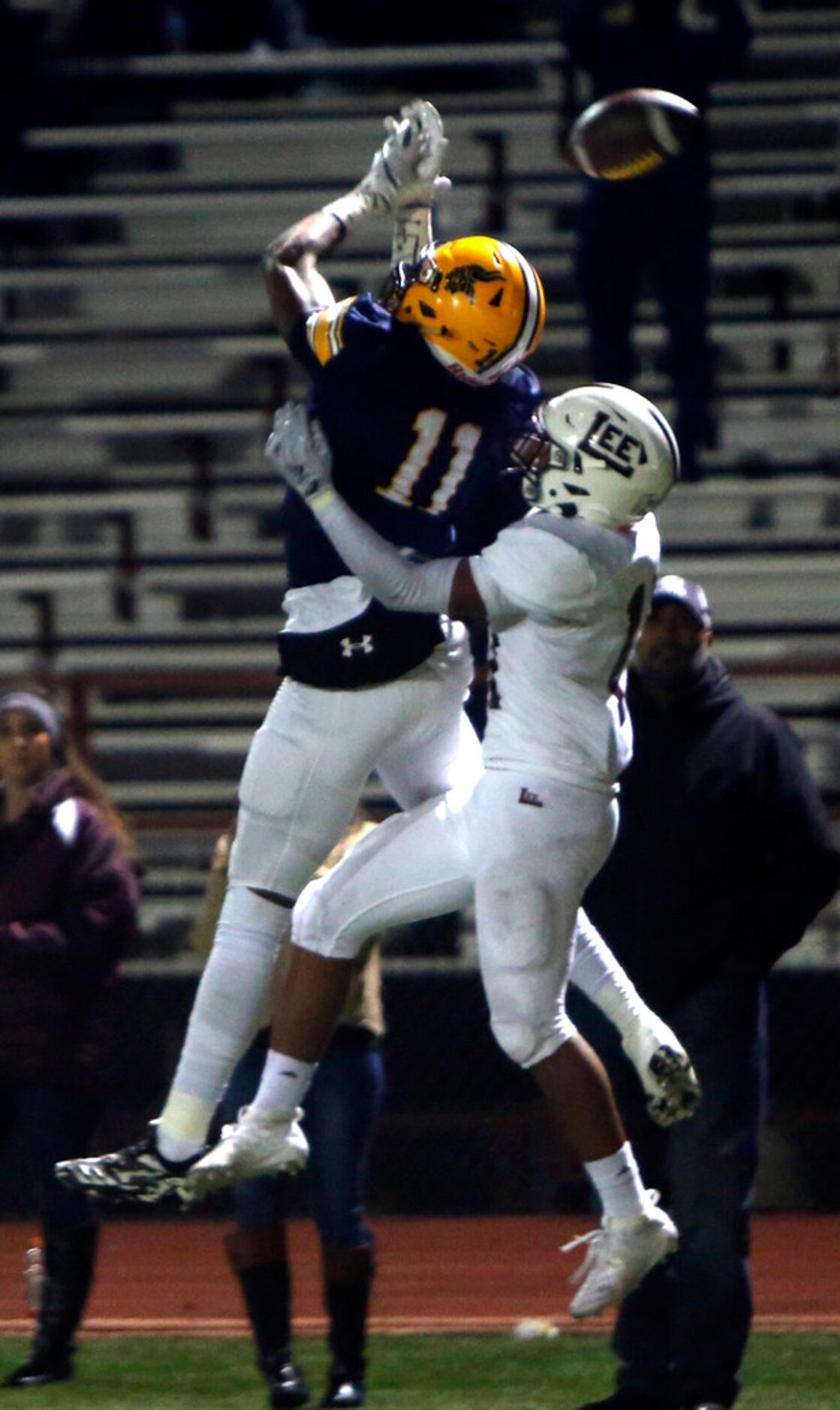 Arlington Lamar receiver Cam Brady (11) is unable to pull in a pass against the defense of...