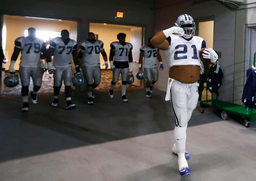 Dallas Cowboys offensive guard Joe Looney (73) makes his way to the field in a Dallas...