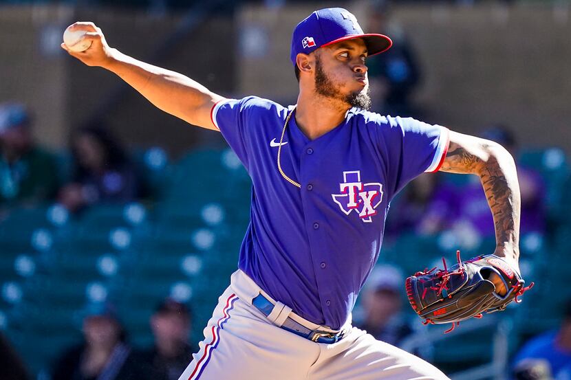 FILE — Texas Rangers pitcher Jonathan Hernandez pithes during the fourth inning of a spring...
