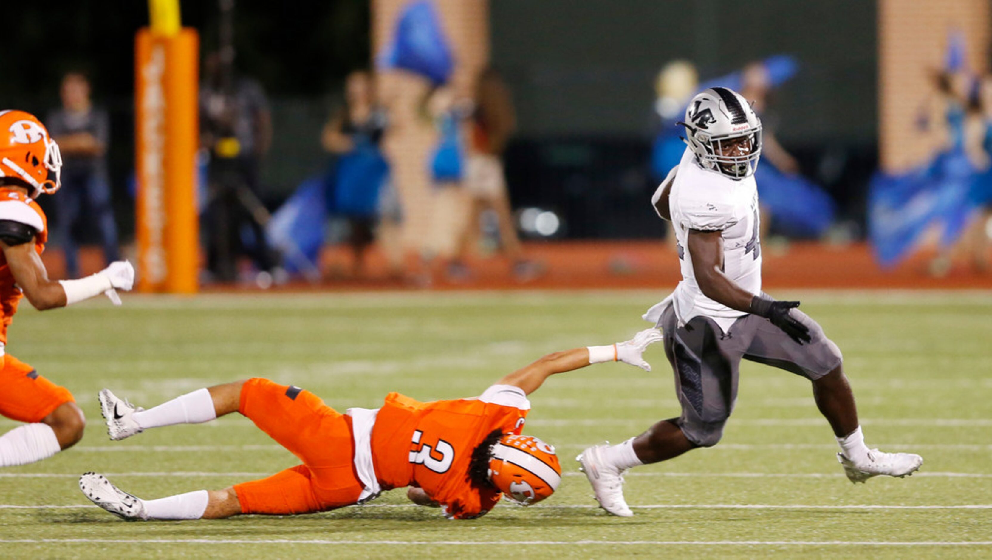 Arlington Martin's Chris Craft (41) runs past Rockwall's Jaxon Rife (3) during the first...