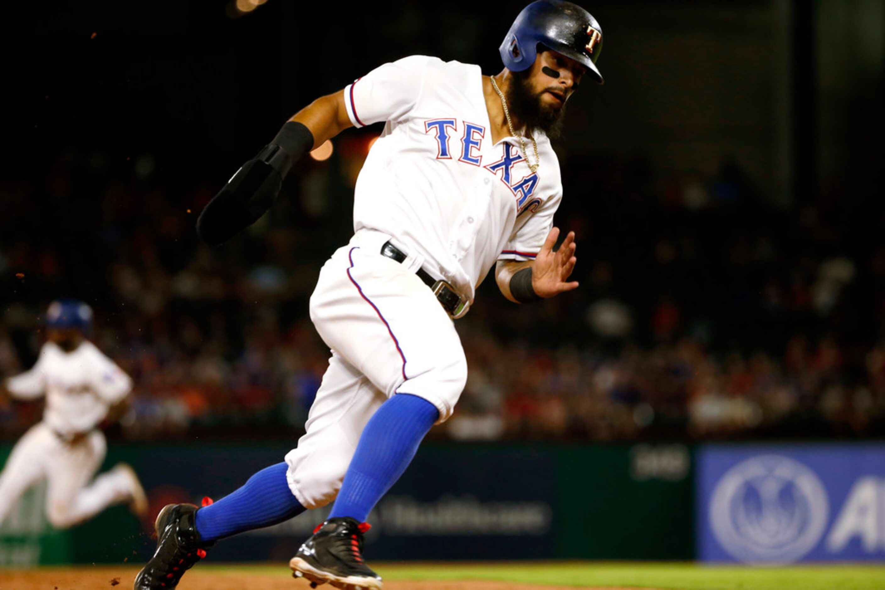 Texas Rangers Rougned Odor rounds third base on his way to scoring against the San Diego...