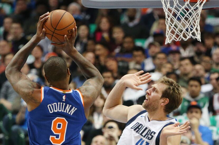 New York Knicks center Kyle O'Quinn (9) shoots the ball while being defended by Dallas...