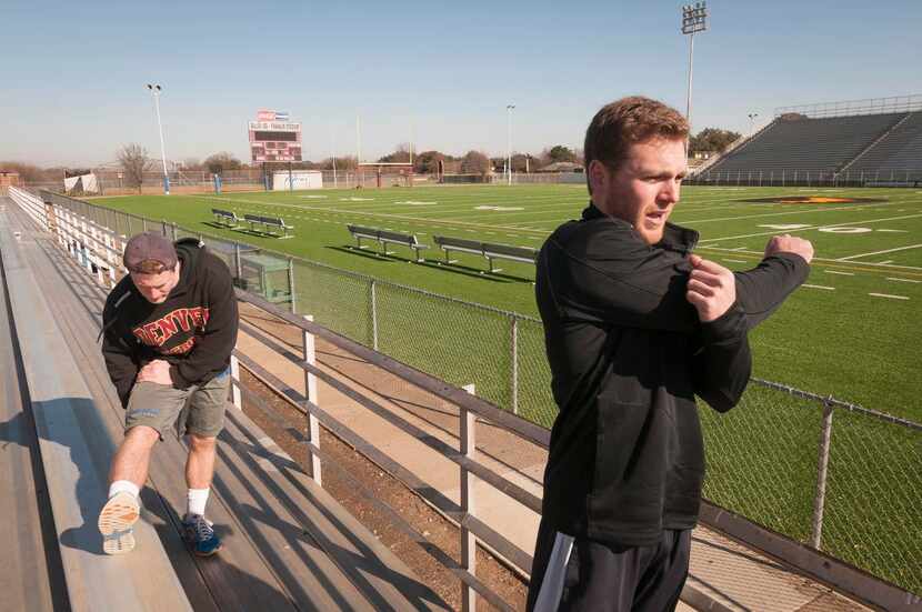 
Hayden Wilson (left) and his older brother, Travis, prepare to run the bleachers at...