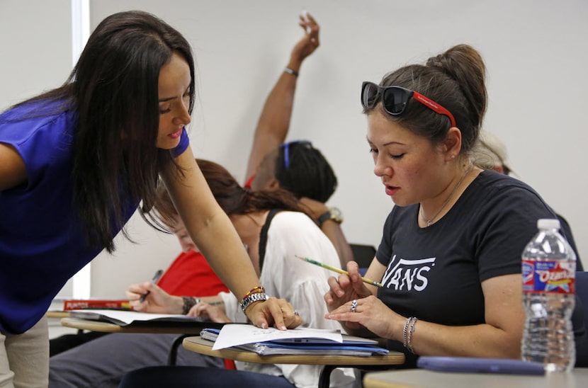 Wendy Birdsall gets some help from instructor Ana Melgarejo Acosta's in Spanish class at SMU...