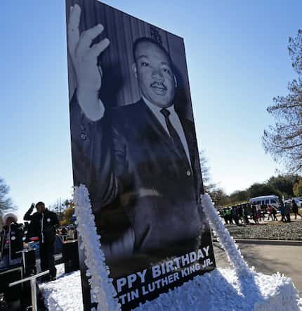 A float carrying a photo of the Rev. Martin Luther King Jr. arrived at Fair Park after the...